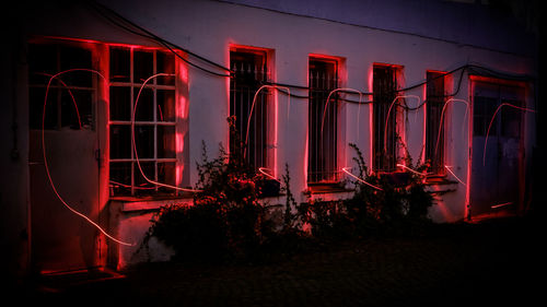 Illuminated red lights in city at night