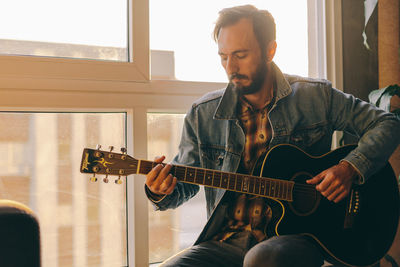 Young man playing guitar