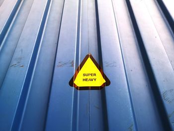 High angle view of information sign on railing