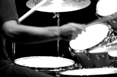 Close-up of man playing piano