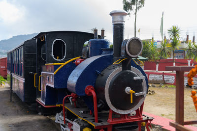 Train on railroad track against sky