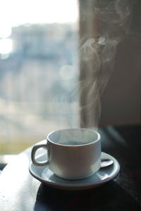 Close-up of coffee cup on table