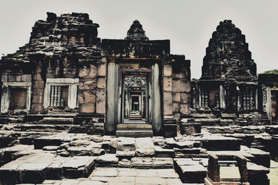 Old temple building against sky