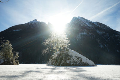 Scenic view of snow covered mountains against sky