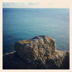 Scenic view of sea against blue sky