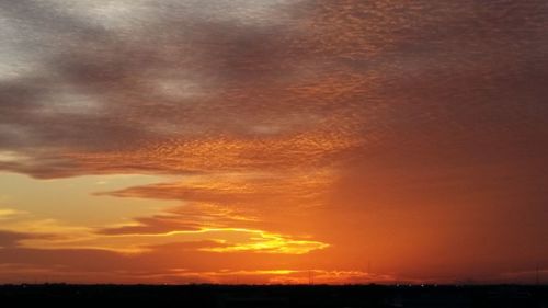 Scenic view of dramatic sky during sunset