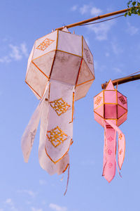 Close-up of two paper lanterns. gold details.