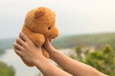 Close-up of hand holding stuffed toy