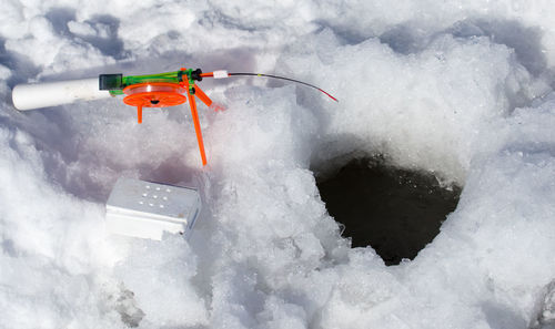 High angle view of toy car on snow covered landscape