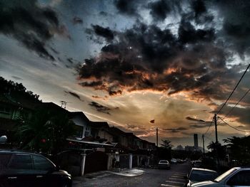 Scenic view of wet road against sky during sunset