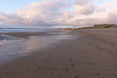 Scenic view of beach against sky