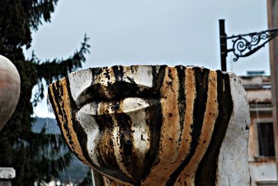 Close-up of rusty metallic structure against clear sky