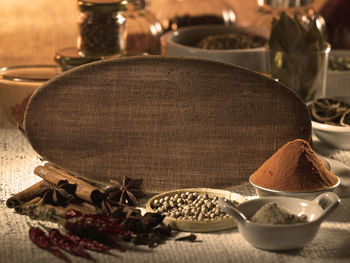 Various spices with cutting board on table