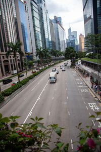 Cars on city street amidst buildings