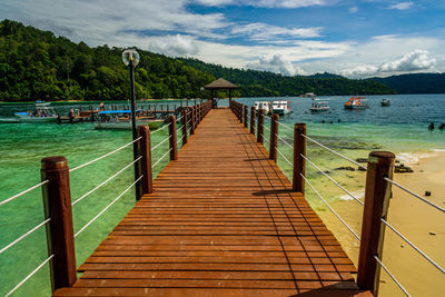 Pier over sea against sky