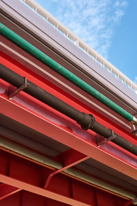 Low angle view of multi colored bridge against sky