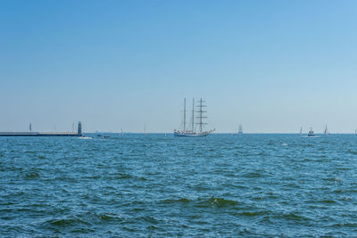 Scenic view of sea against clear blue sky