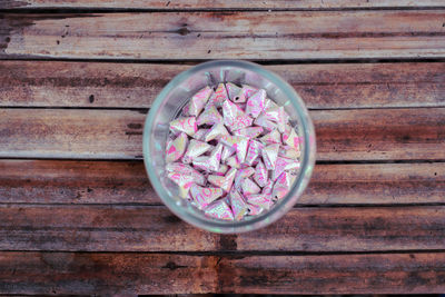 High angle view of pink flowers in bowl on table