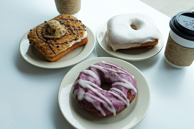 Close up assorted sweet donut served with hot coffee