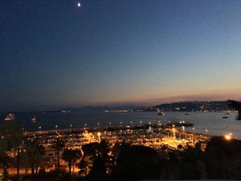 High angle view of illuminated cityscape at night