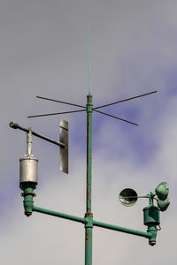 Low angle view of street light against sky