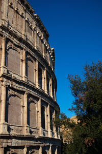 Low angle view of historical building against blue sky