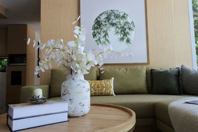 Flower vase on table at home