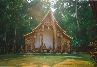 Golden gate in temple against building