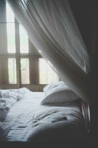 Close-up of messy bed in bedroom