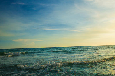 Scenic view of sea against blue sky