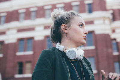 Close-up of young woman standing outdoors