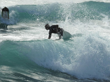 Man splashing water in sea