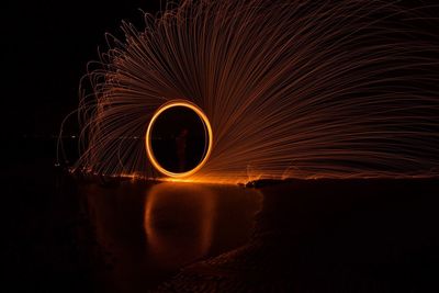 Wire wool over sea at night