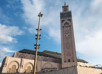 Low angle view of hassan ii mosque against sky