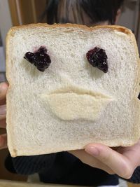 Close-up of hand holding ice cream
