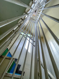 Low angle view of building seen through glass window