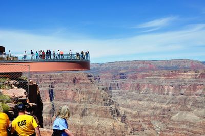 People on rock looking at view