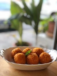 Close-up of strawberries in plate on table