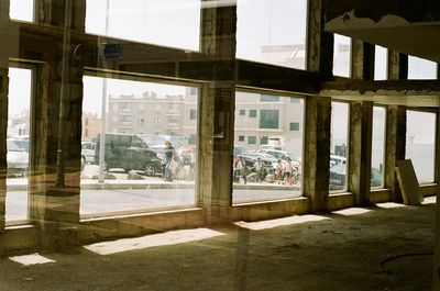 View of apartment building seen through window