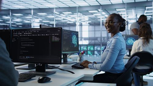 Rear view of woman working in office