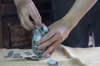 Midsection of man working on table