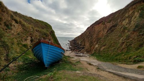 Scenic view of cliffs by the beach