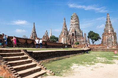 Panoramic view of temple by building against sky