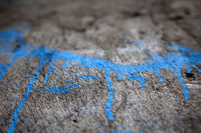 Blue paint on textured surface