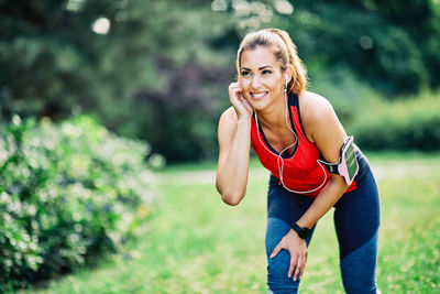 Portrait of a smiling young woman running