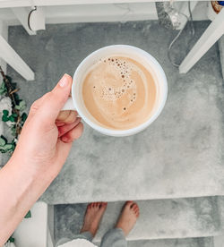 High angle view of coffee cup on table