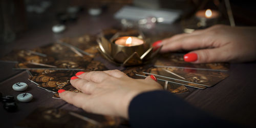 Cropped hand of person working on table