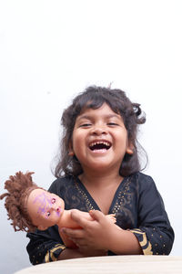 Portrait of a smiling girl over white background