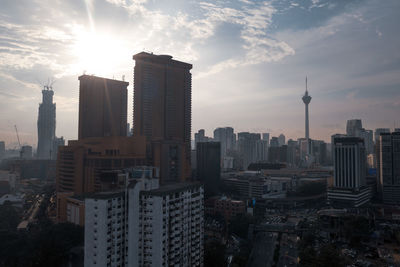 Modern buildings in city against sky