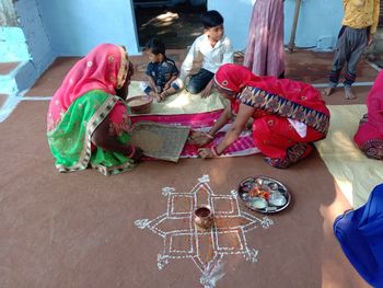 High angle view of people sitting on floor